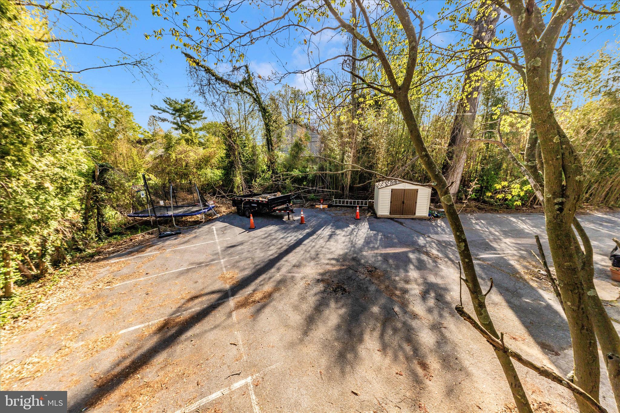 9309 Old Georgetown Road Bethesda, MD 20814 - Photo 50 of 50 a backyard of a house with table and chairs