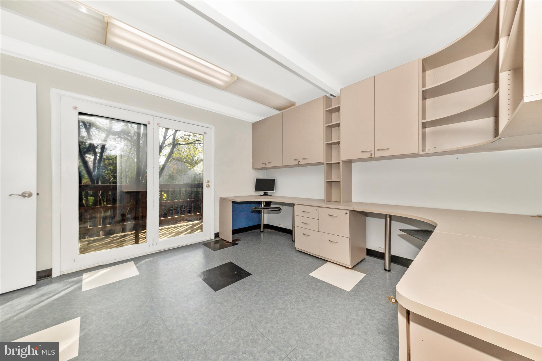 9309 Old Georgetown Road Bethesda, MD 20814 - Photo 5 of 50 a kitchen with a stove and white cabinets