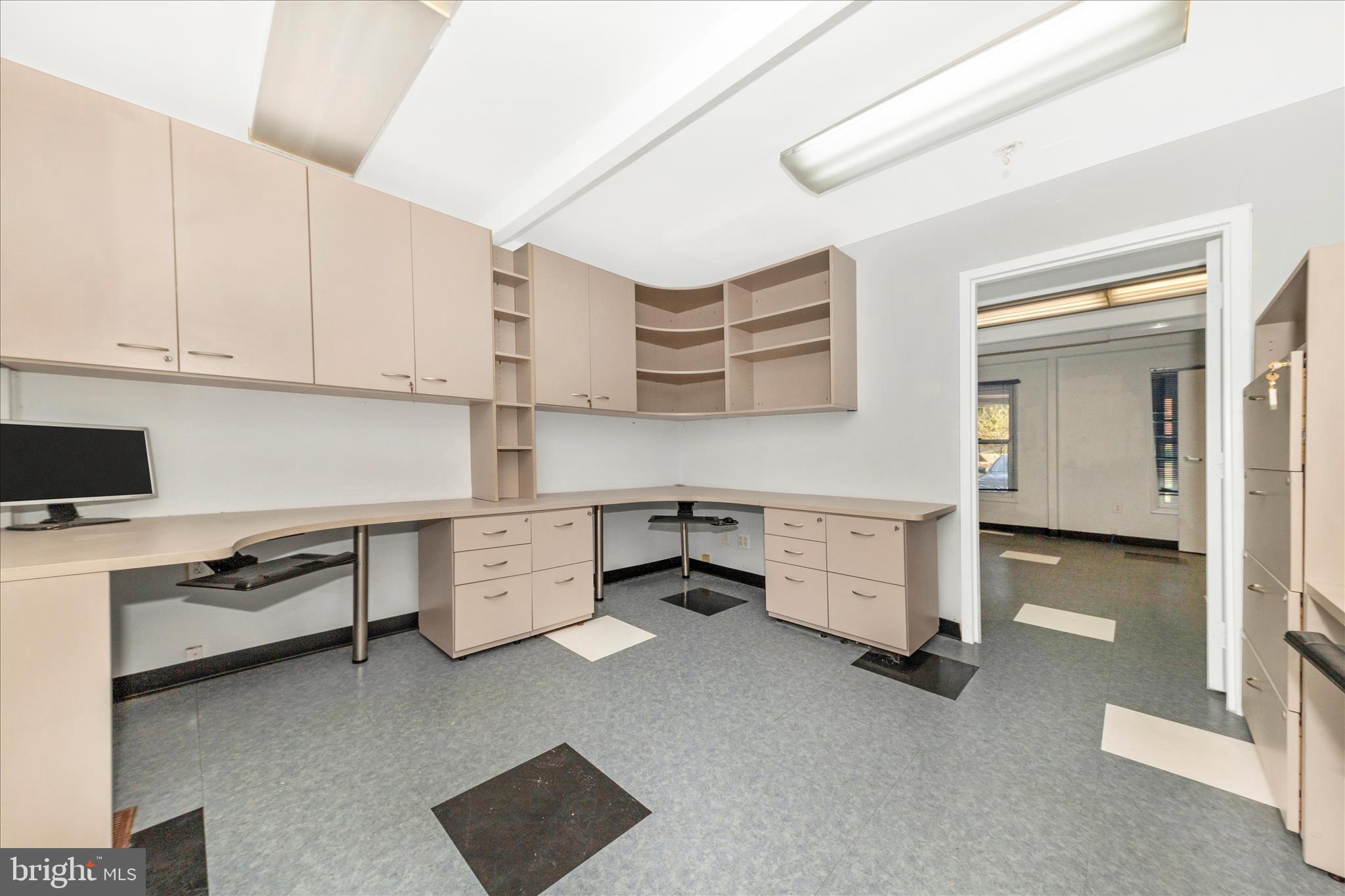 9309 Old Georgetown Road Bethesda, MD 20814 - Photo 7 of 50 a room with cabinets and a stove top oven