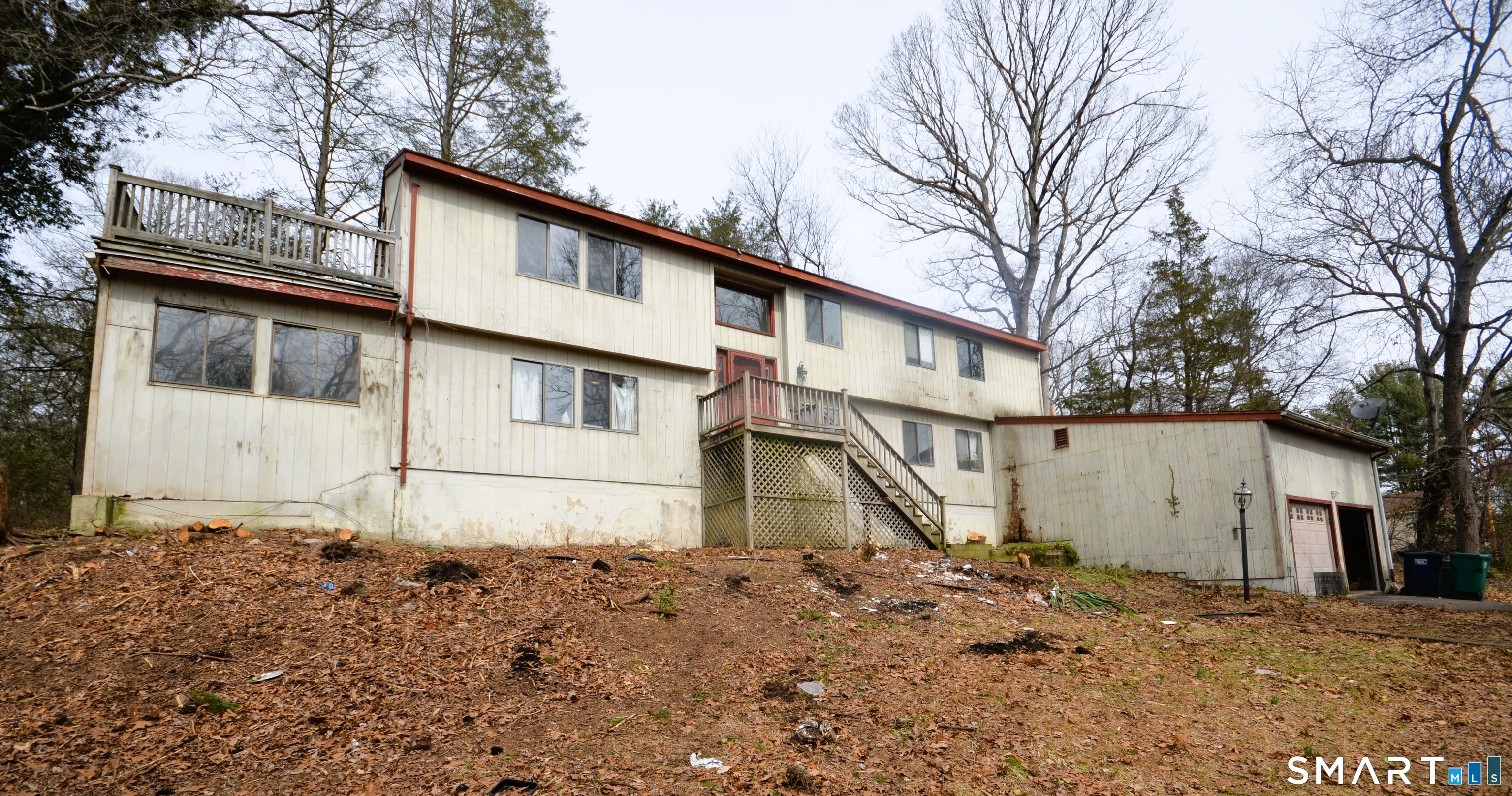 215 Saxonwood Road Fairfield, CT 06825 - Photo 1 of 24 a house with trees in front of it