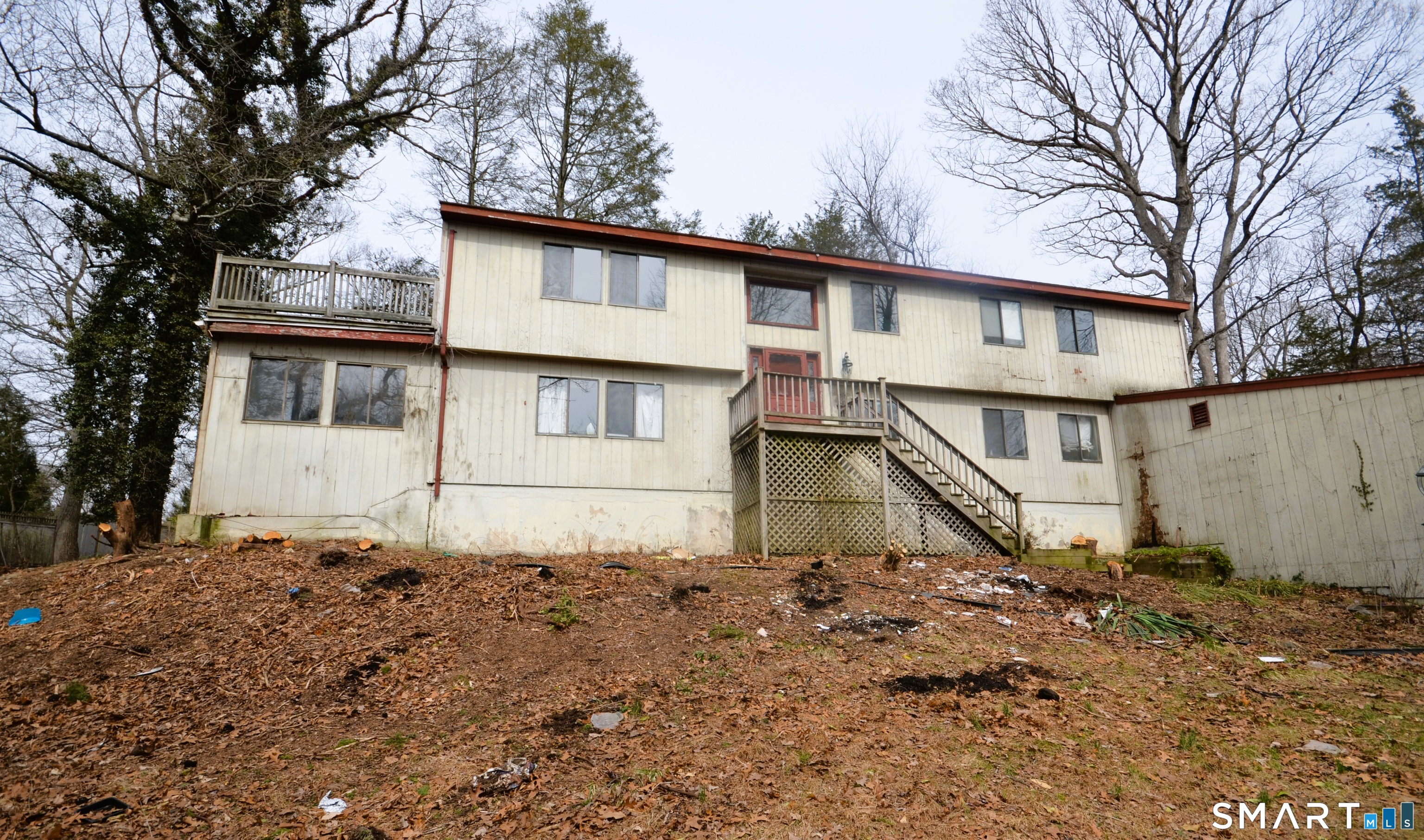 215 Saxonwood Road Fairfield, CT 06825 - Photo 2 of 24 a house with trees in the background