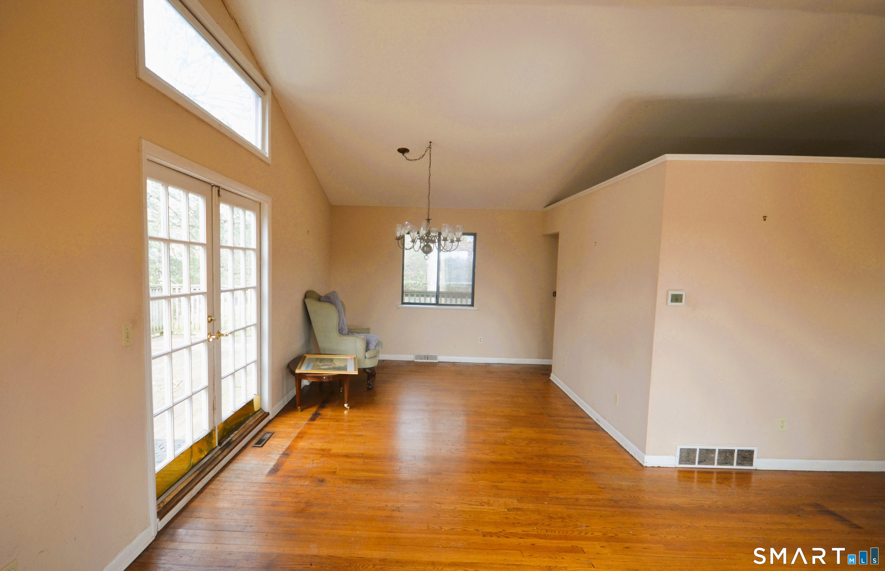 215 Saxonwood Road Fairfield, CT 06825 - Photo 3 of 24 a view of an empty room with a window