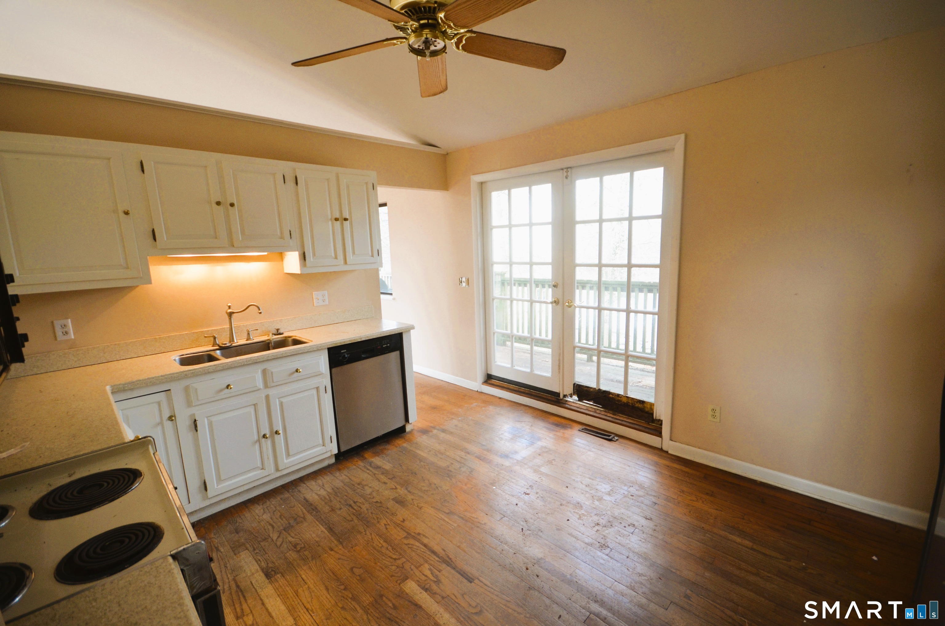 215 Saxonwood Road Fairfield, CT 06825 - Photo 10 of 24 a kitchen with stainless steel appliances a sink a stove a refrigerator and cabinets