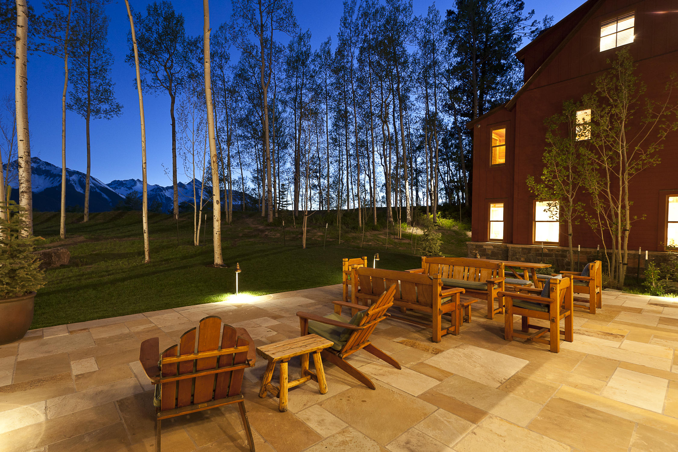 225 Raspberry Patch Road Telluride, CO 81435 - Photo 16 of 24 a view of a patio with table and chairs with wooden floor and fence