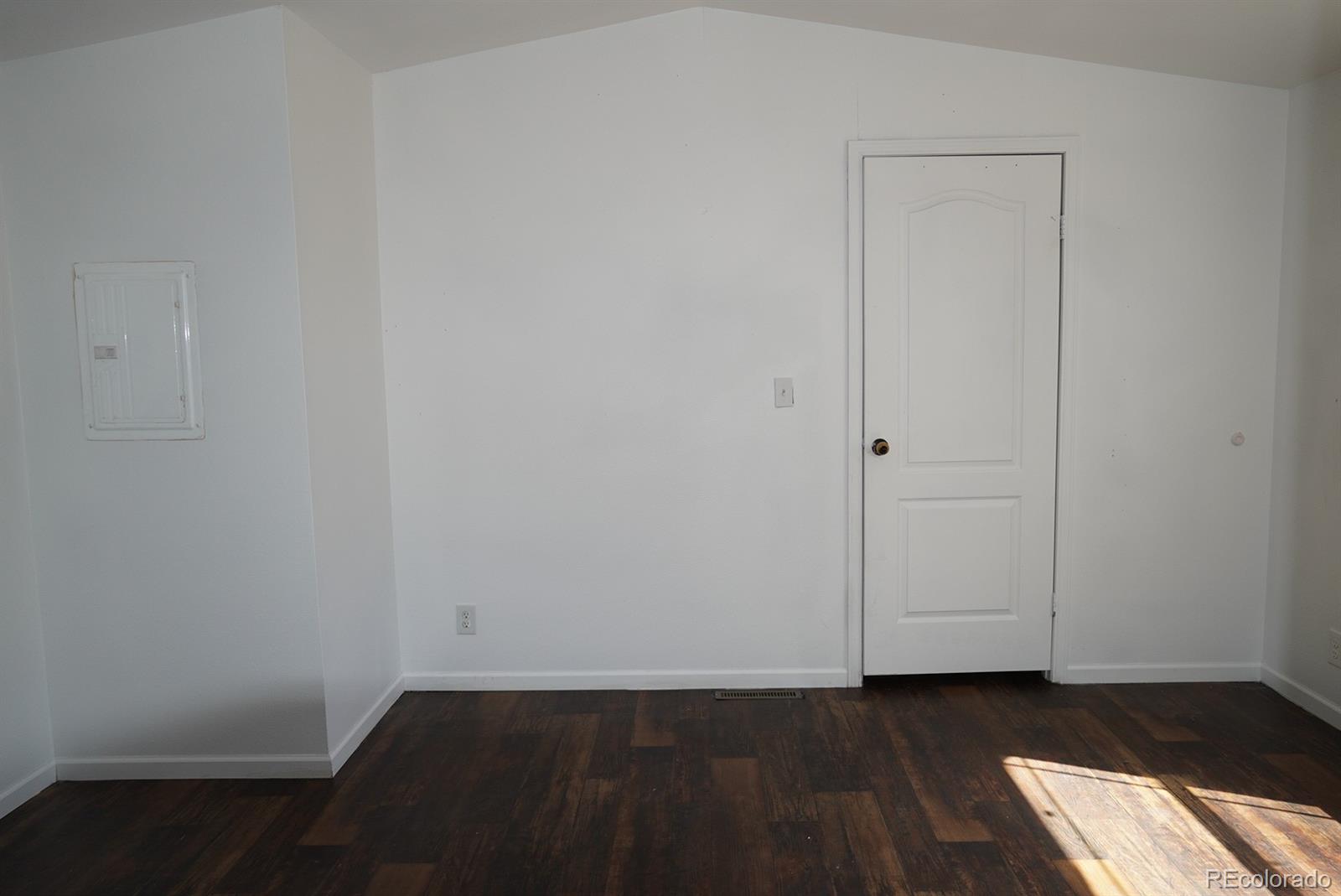 9100 Tejon Street Denver, CO 80260 - Photo 11 of 23 a view of an empty room with wooden floor and closet