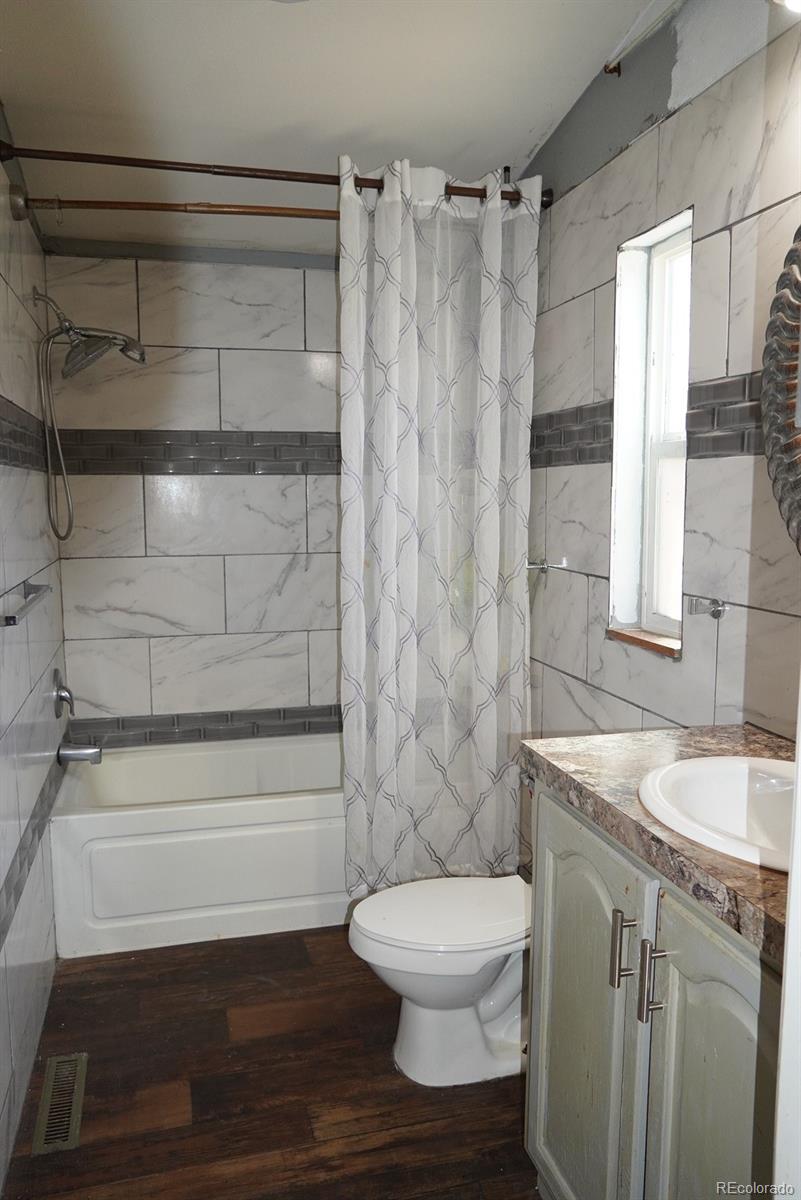 9100 Tejon Street Denver, CO 80260 - Photo 12 of 23 a bathroom with a sink a toilet and shower