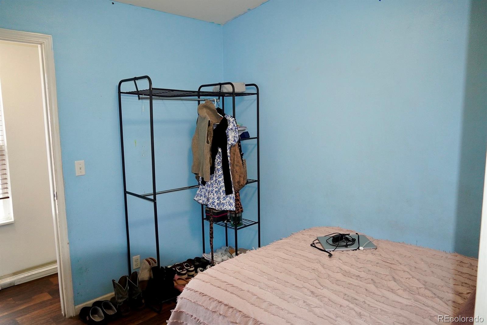 9100 Tejon Street Denver, CO 80260 - Photo 16 of 23 a bedroom with a bed and a mirror