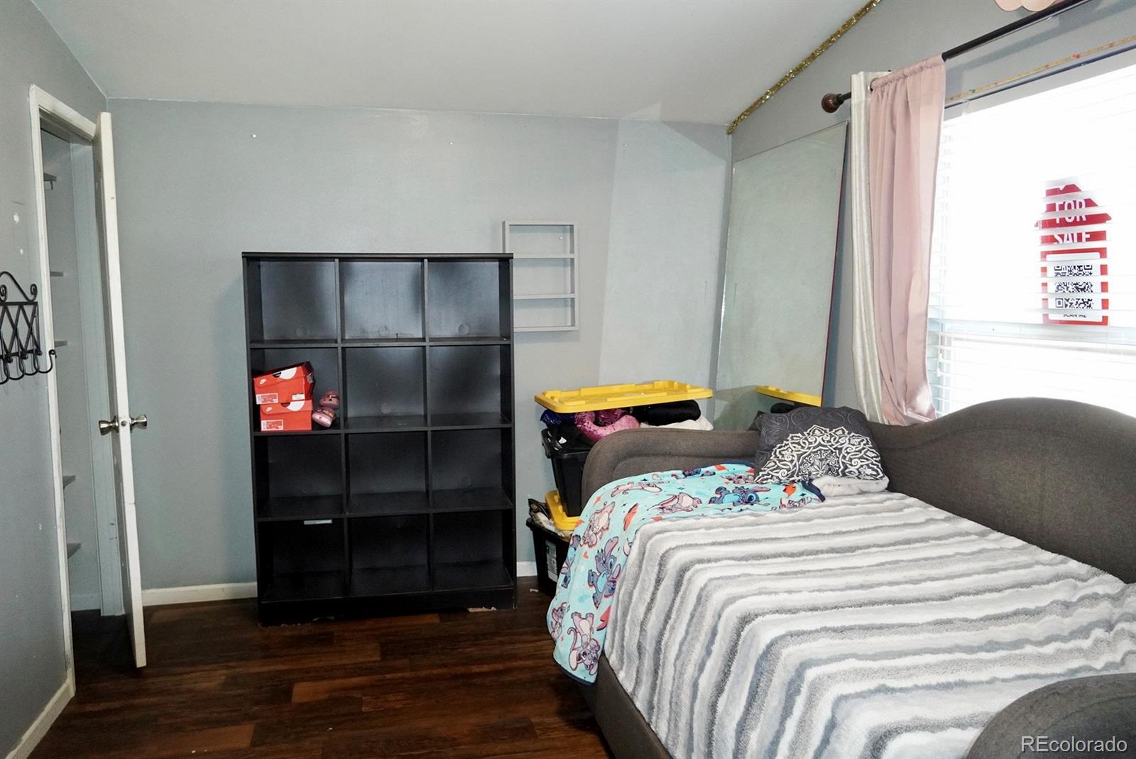 9100 Tejon Street Denver, CO 80260 - Photo 18 of 23 a bedroom with a bed and a window