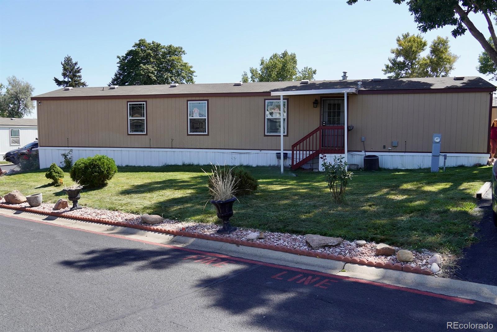 9100 Tejon Street Denver, CO 80260 - Photo 3 of 23 front view of a house with a yard