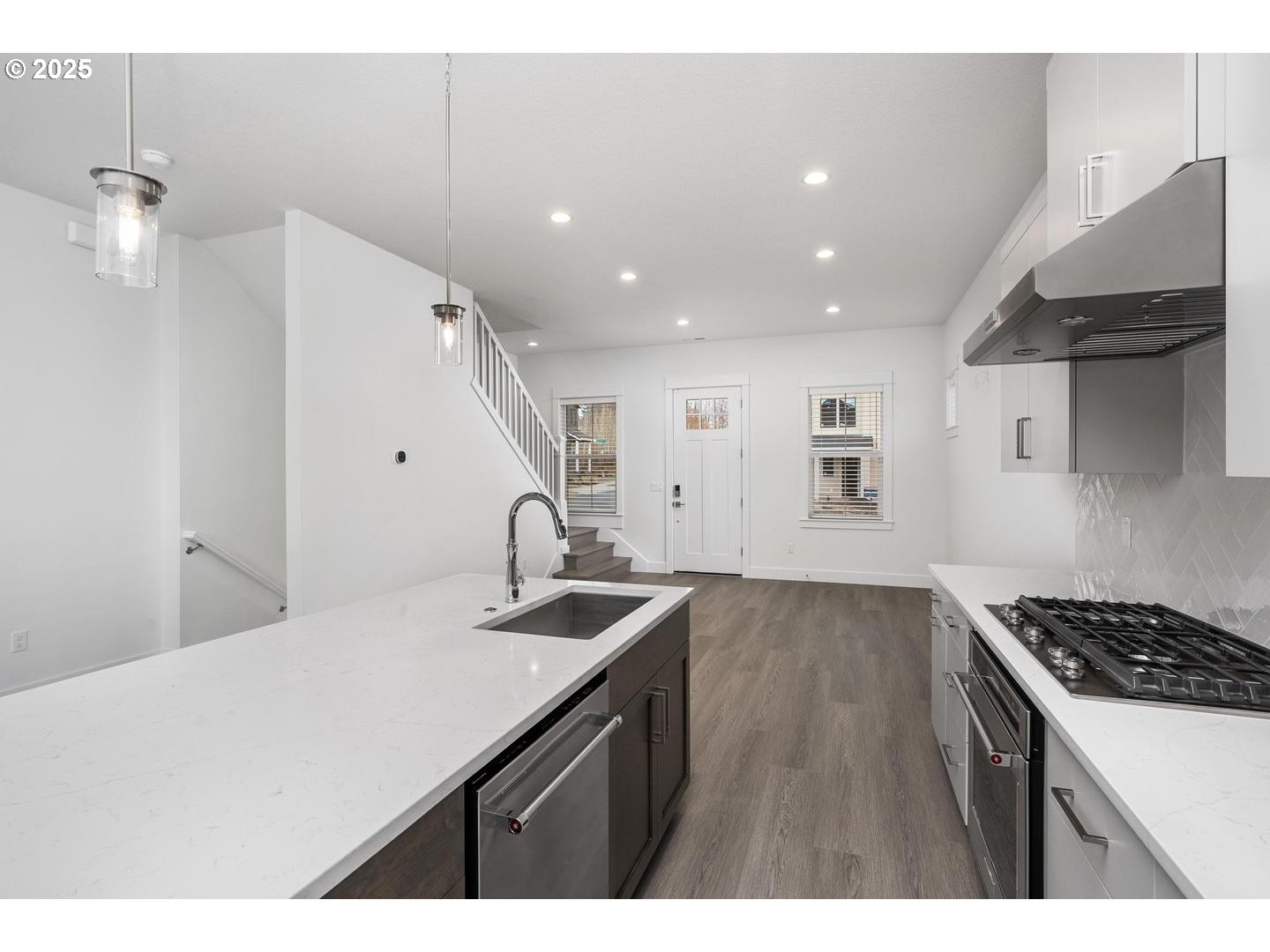 16005 Northwest Holman Way Portland, OR 97229 - Photo 14 of 48 a kitchen with a sink stainless steel appliances and cabinets