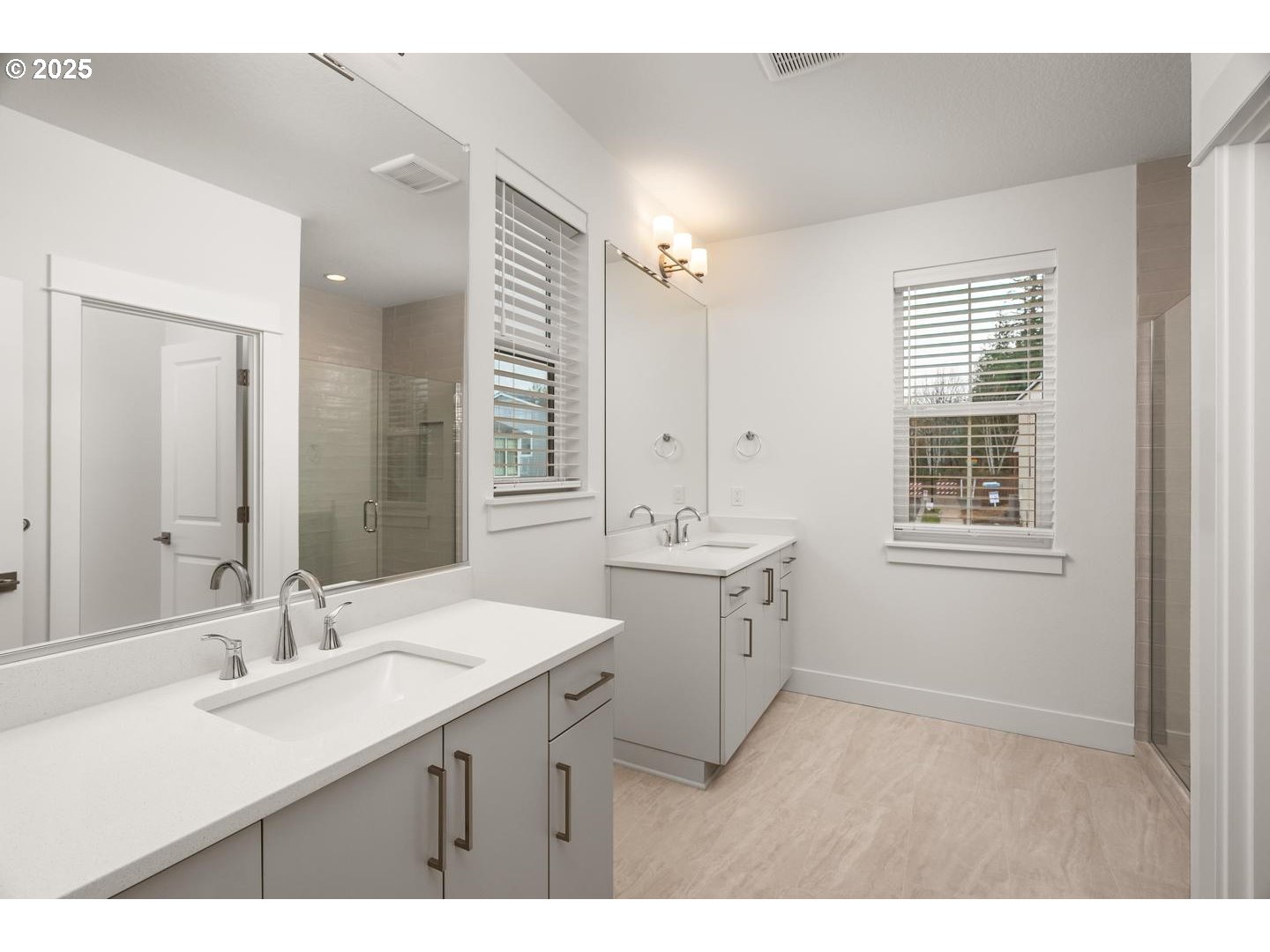 16005 Northwest Holman Way Portland, OR 97229 - Photo 21 of 48 a bathroom with a sink double vanity and a mirror