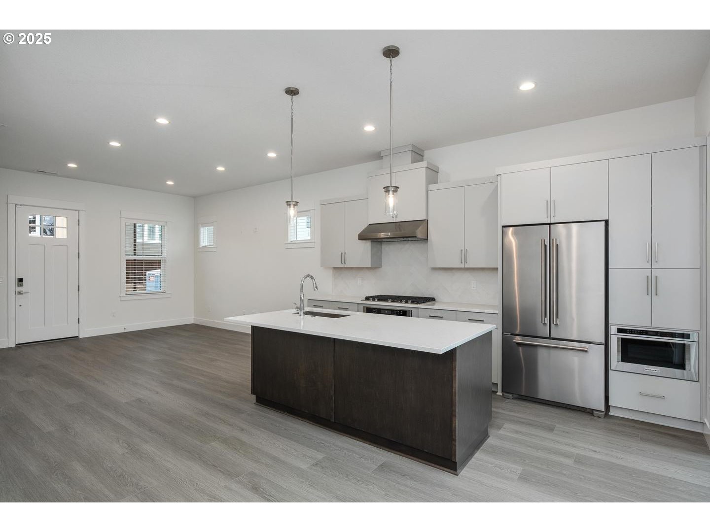 16005 Northwest Holman Way Portland, OR 97229 - Photo 9 of 48 a kitchen with kitchen island a sink stainless steel appliances and cabinets