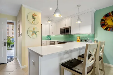 a kitchen with a table and chairs
