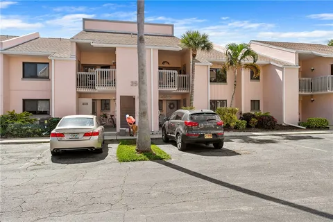 a view of cars parked in front of a building
