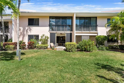 a view of an house with backyard porch and garden
