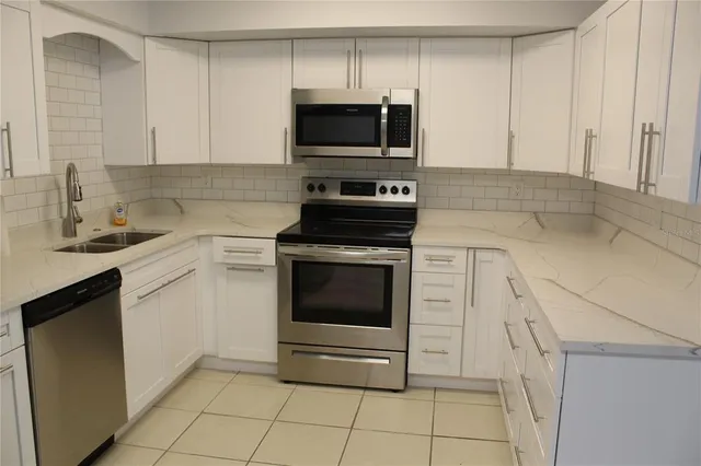 a bathroom with a shower a toilet and a tub