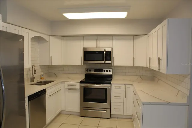 a bathroom with a window and a shower