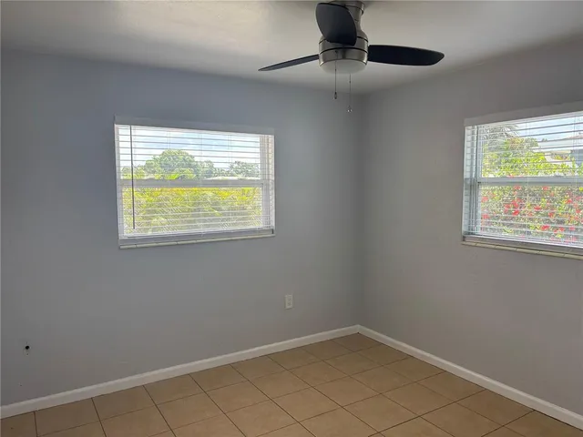 en empty room with windows