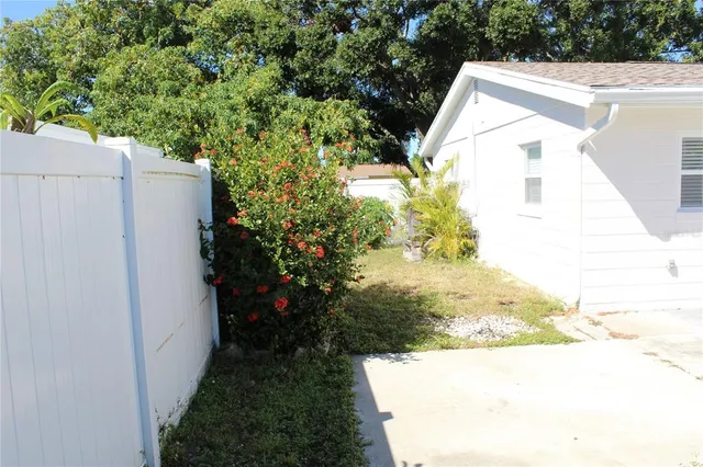 a view of a back yard of a house