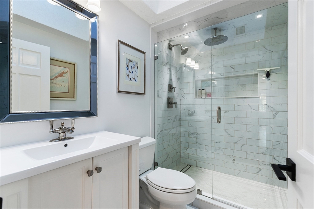 4 Senator Road Woburn, MA 01801 - Photo 15 of 36 a bathroom with a sink toilet and shower