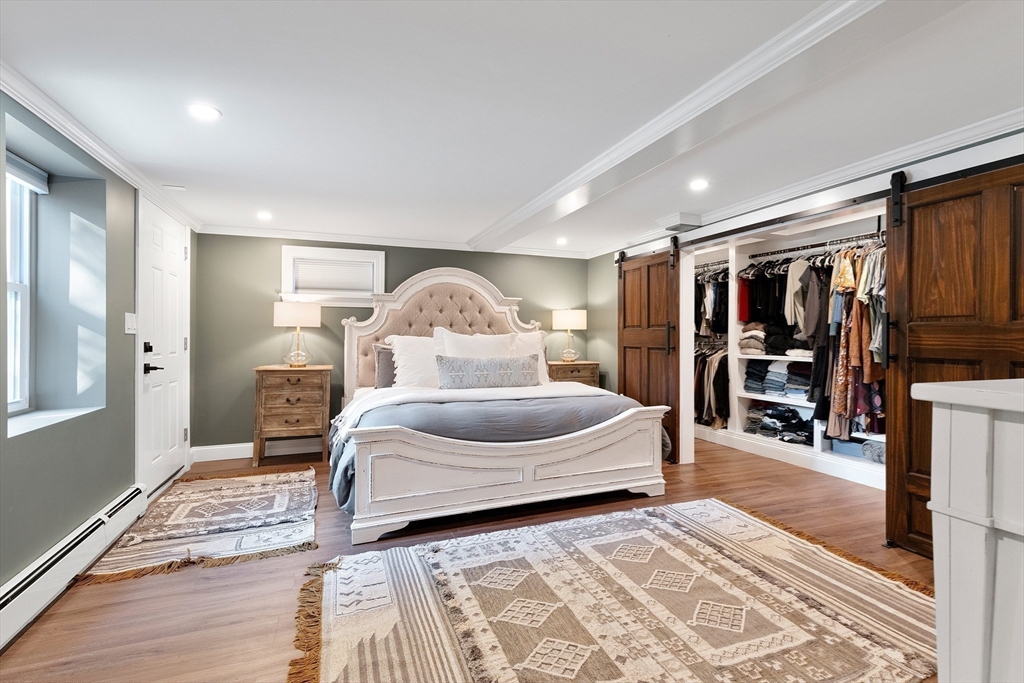 4 Senator Road Woburn, MA 01801 - Photo 19 of 36 a bedroom with a large bed and a window