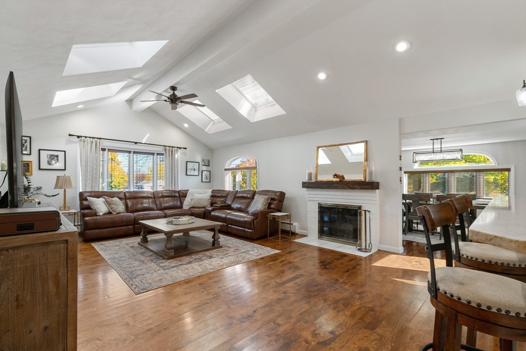 4 Senator Road Woburn, MA 01801 - Photo 2 of 36 a living room with fireplace furniture and a flat screen tv