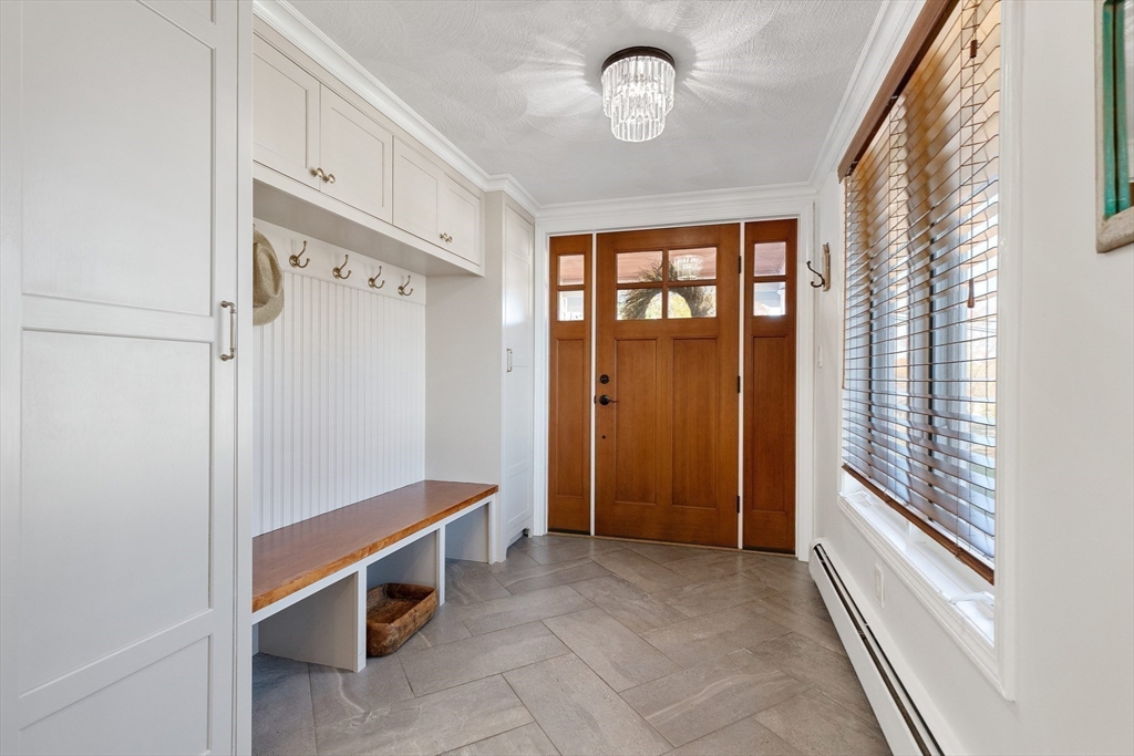 4 Senator Road Woburn, MA 01801 - Photo 4 of 36 a room with window and a chandelier