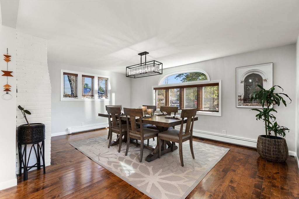 4 Senator Road Woburn, MA 01801 - Photo 9 of 36 a view of a dining room with furniture window and wooden floor