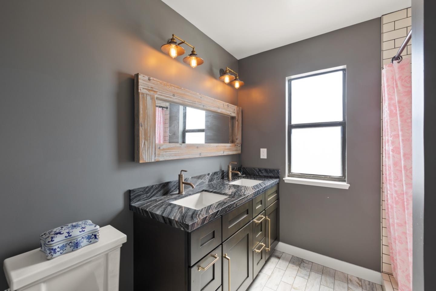 2346 Beach Boulevard Pacifica, CA 94044 - Photo 12 of 22 a bathroom with a sink vanity and a mirror
