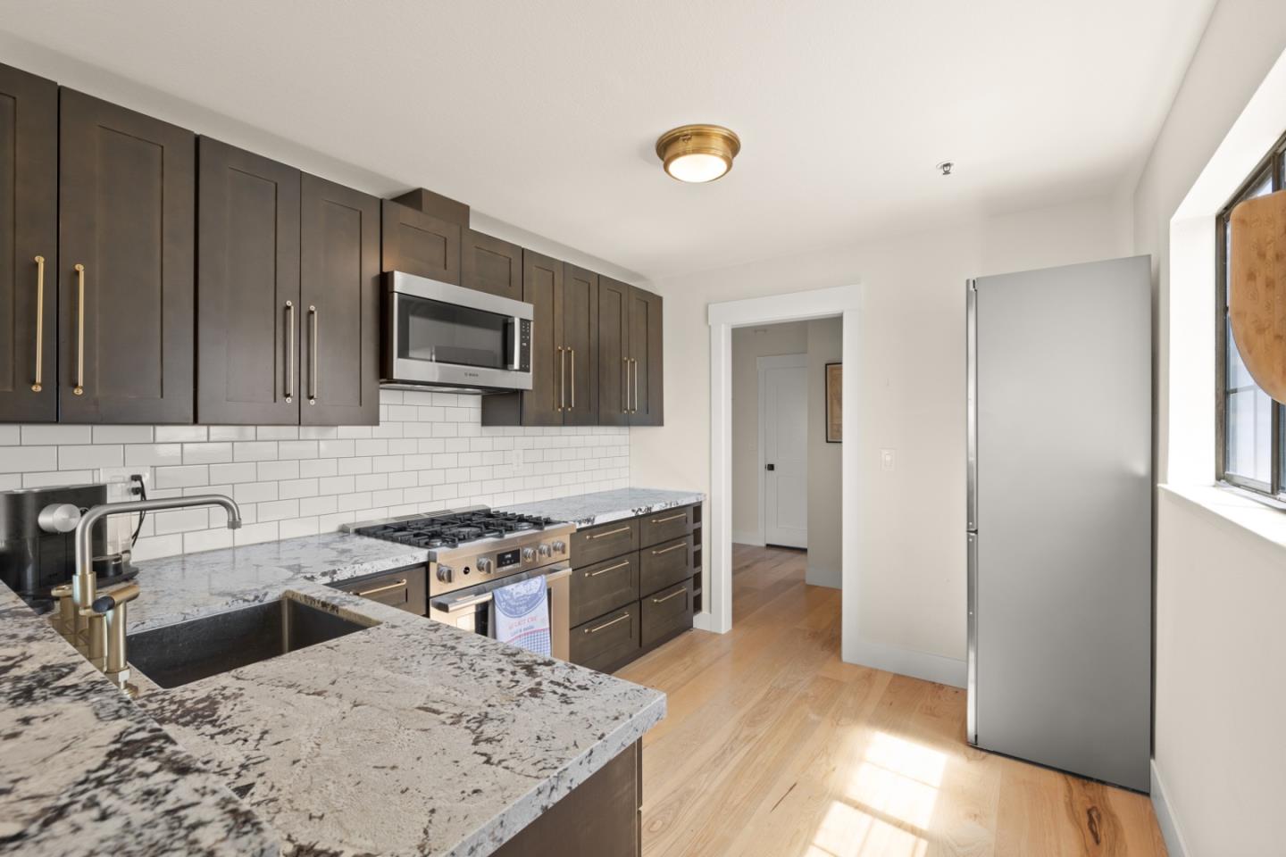 2346 Beach Boulevard Pacifica, CA 94044 - Photo 5 of 22 a kitchen with a sink stove and refrigerator