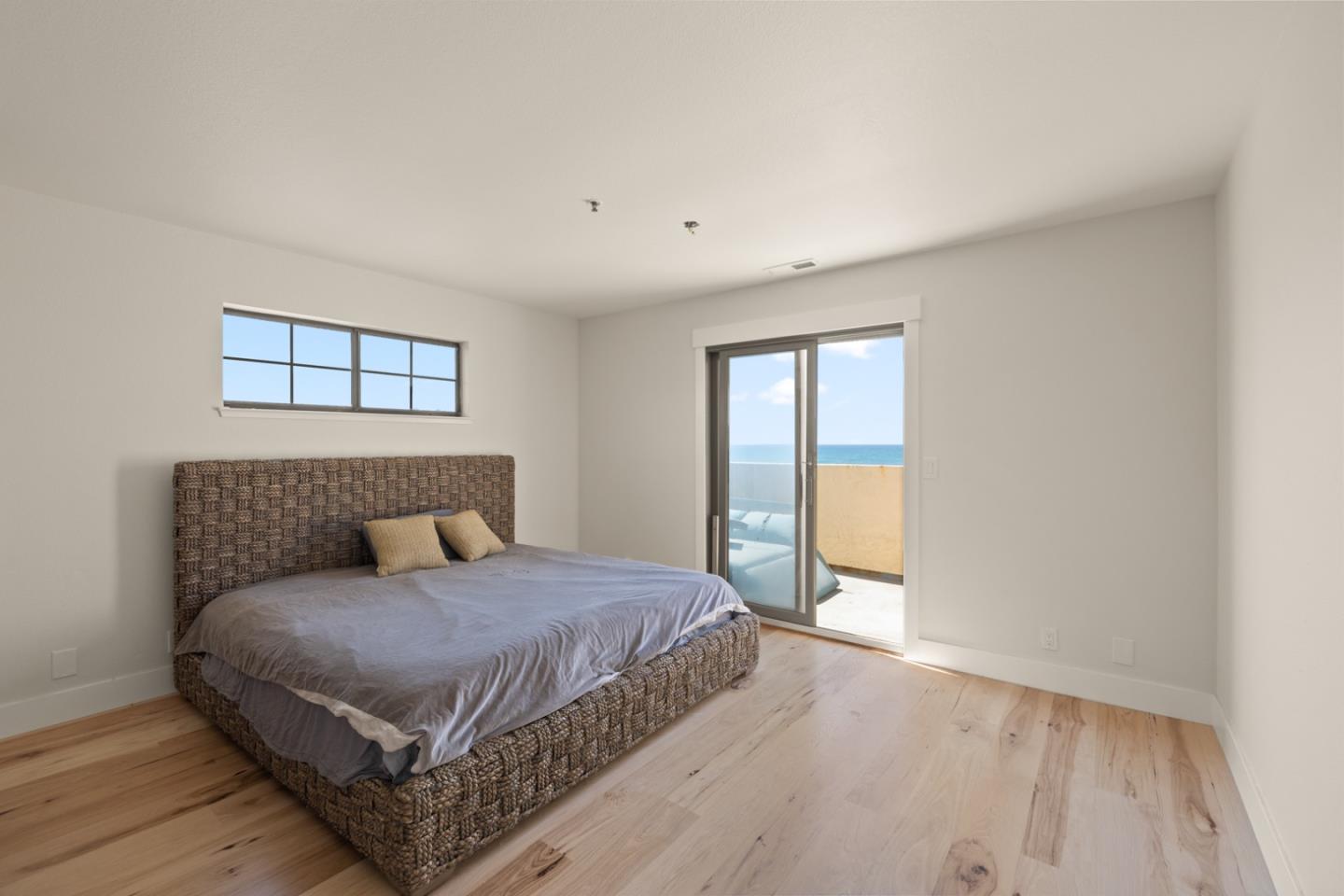 2346 Beach Boulevard Pacifica, CA 94044 - Photo 10 of 22 a bedroom with a large bed and a window