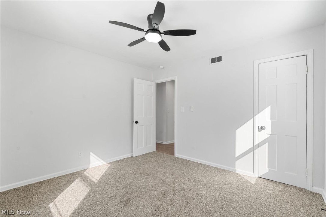 2401 Greenvale Road Cleveland, OH 44121 - Photo 19 of 25 Unfurnished bedroom featuring carpet flooring and ceiling fan