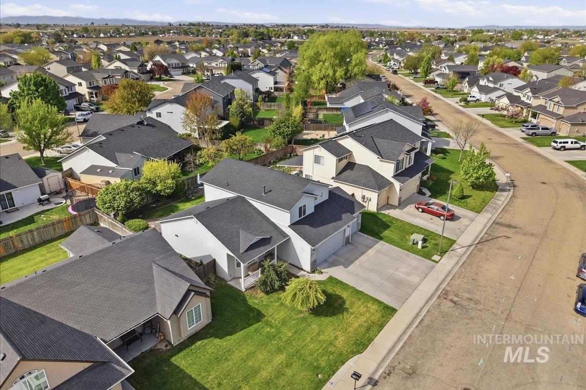 2714 Colfax Drive Caldwell, ID 83607 - Photo 37 of 40 Residential neighborhood featuring a consistent architectural style, asphalt shingle roofs, detached homes, and paved streets with concrete sidewalks