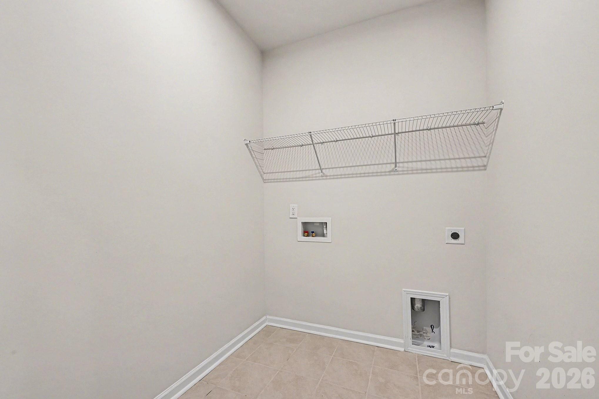 5451 Comiskey Alley Kannapolis, NC 28081 - Photo 14 of 27 a view of a room with racks on the wall
