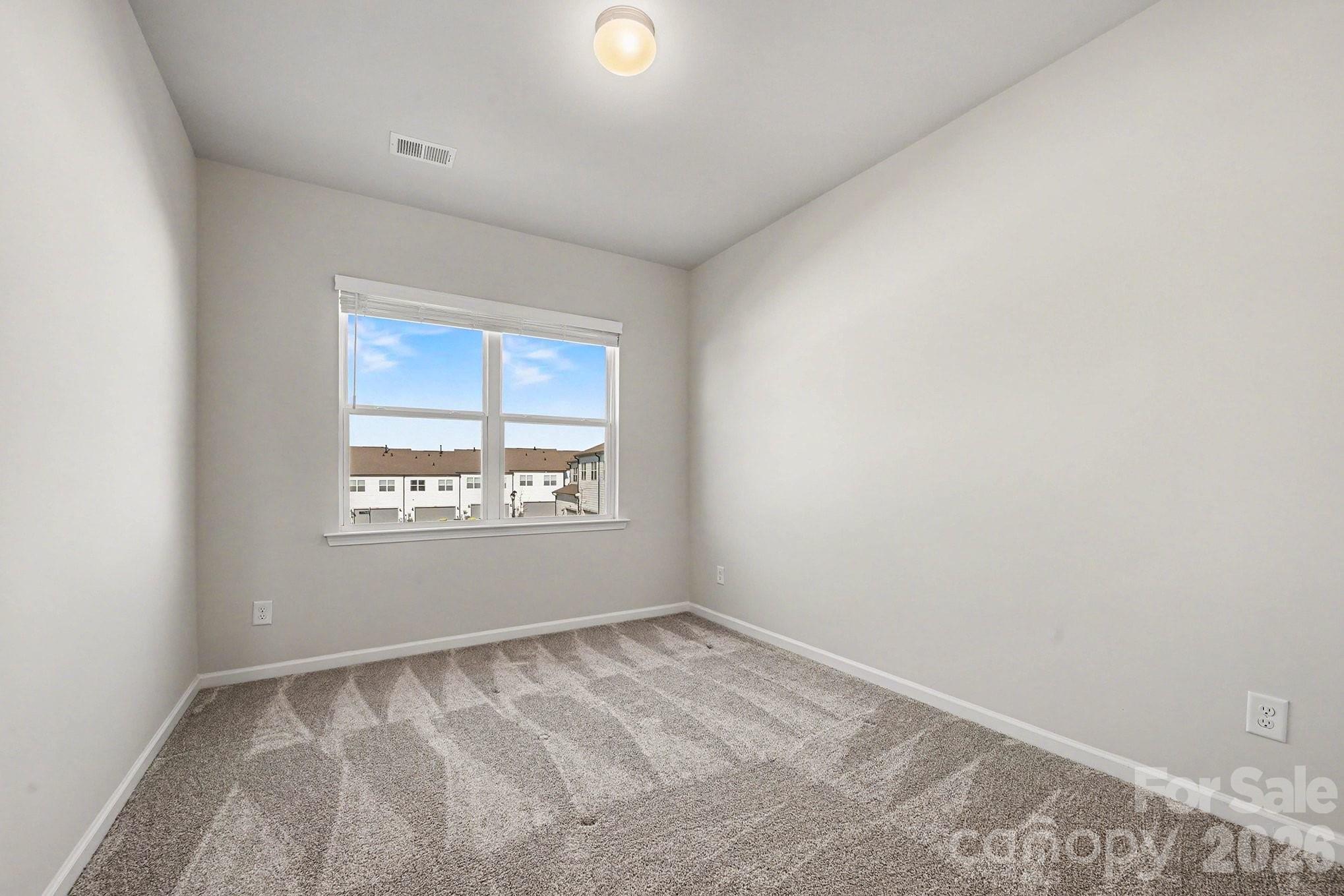 5451 Comiskey Alley Kannapolis, NC 28081 - Photo 20 of 27 an empty room with a window