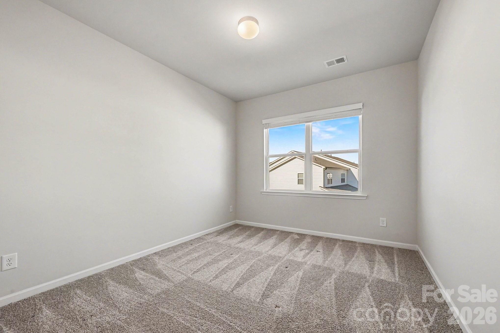 5451 Comiskey Alley Kannapolis, NC 28081 - Photo 21 of 27 an empty room with windows