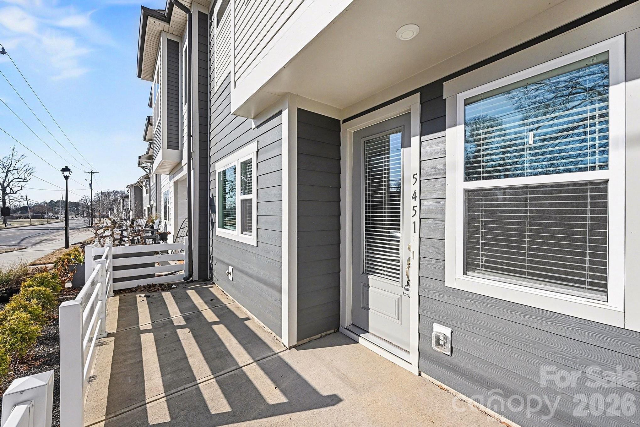 5451 Comiskey Alley Kannapolis, NC 28081 - Photo 3 of 27 a view of a balcony with a potted plant