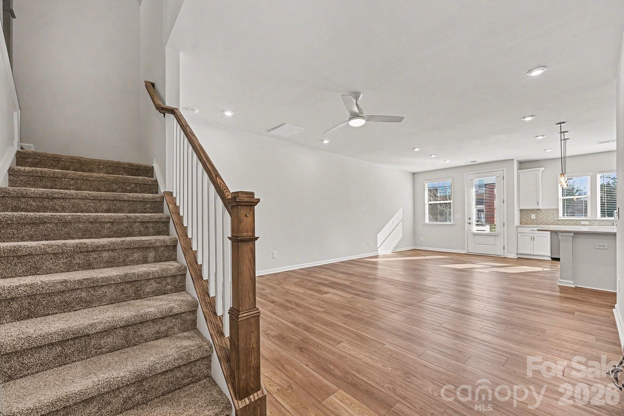 5451 Comiskey Alley Kannapolis, NC 28081 - Photo 5 of 27 a view of an entryway with wooden floor and stairs