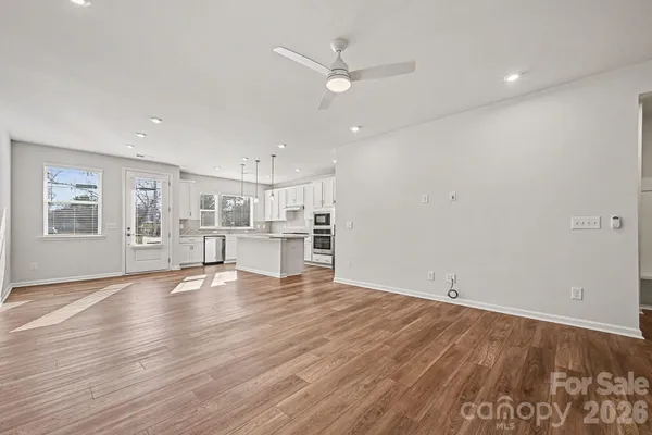 a view of kitchen with wooden floor and window