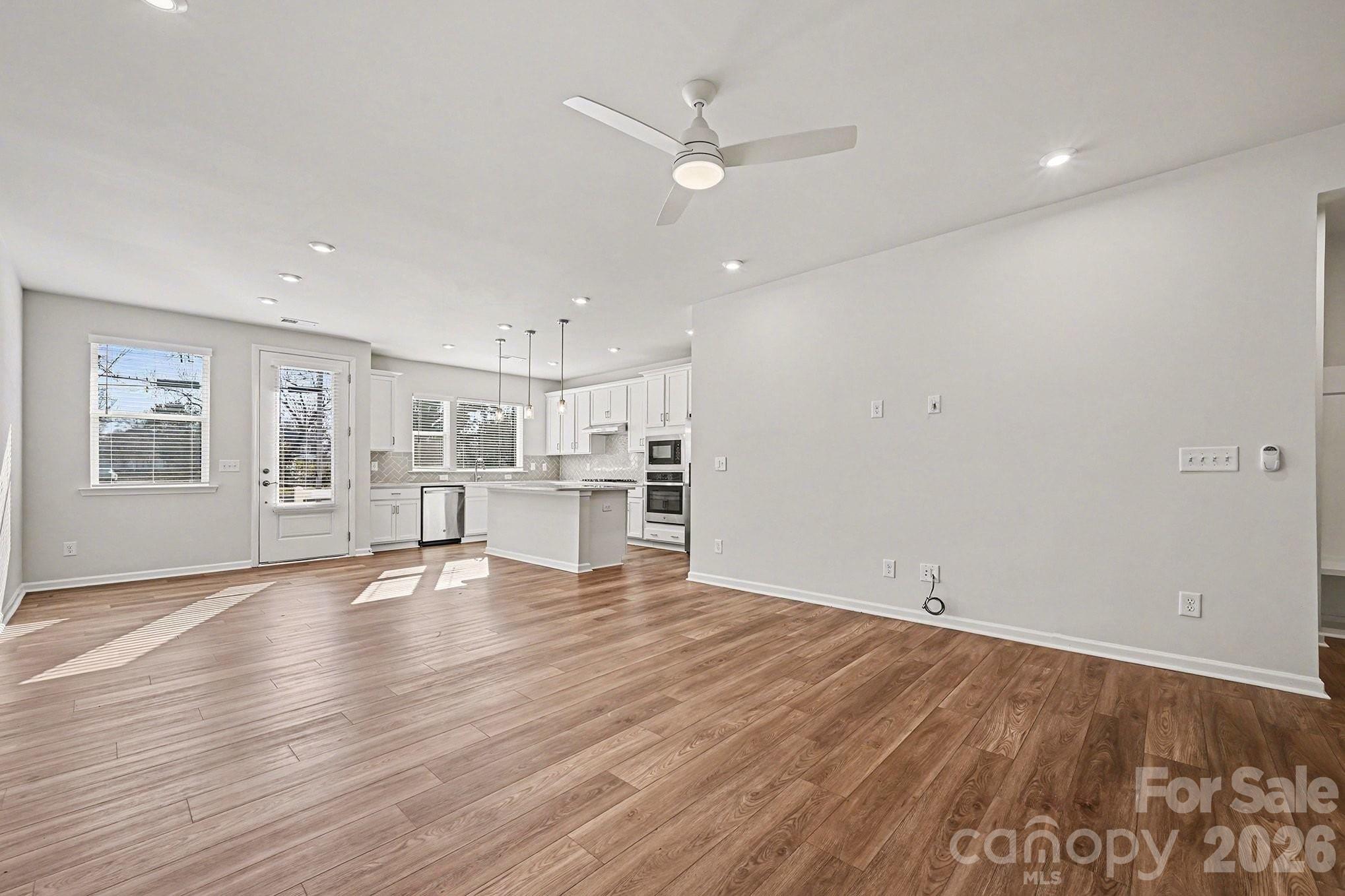 5451 Comiskey Alley Kannapolis, NC 28081 - Photo 6 of 27 a view of kitchen with wooden floor and window