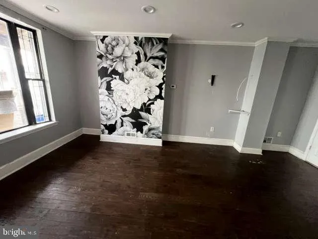 a view of entryway with wooden floor