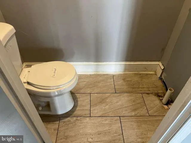 a kitchen with granite countertop a stove a sink dishwasher and a refrigerator