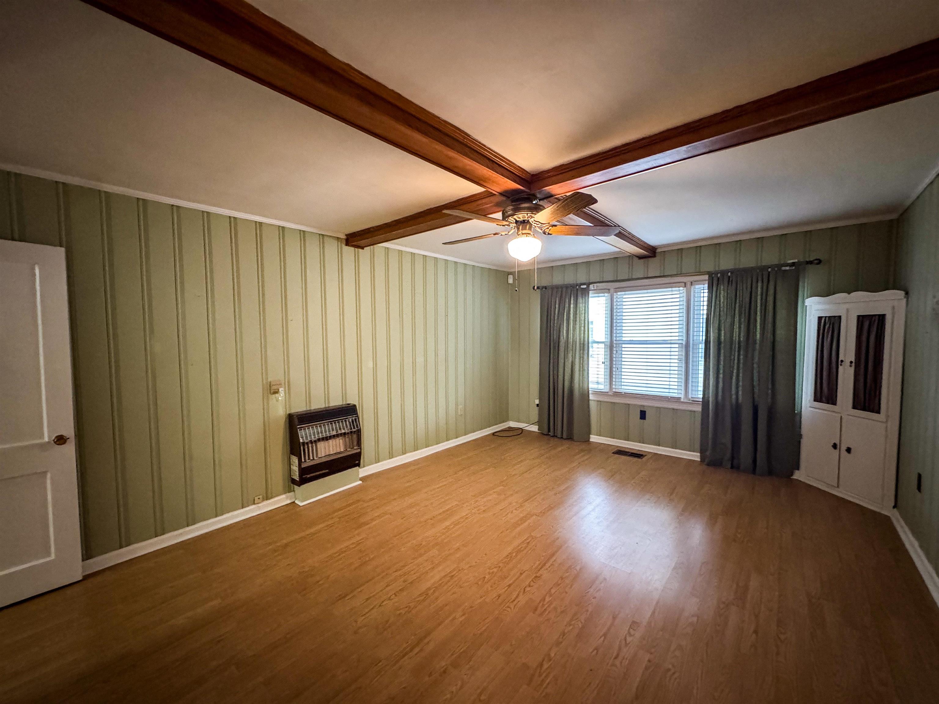 400 Park Street Covington, TN 38019 - Photo 14 of 24 an empty room with windows and chandelier fan
