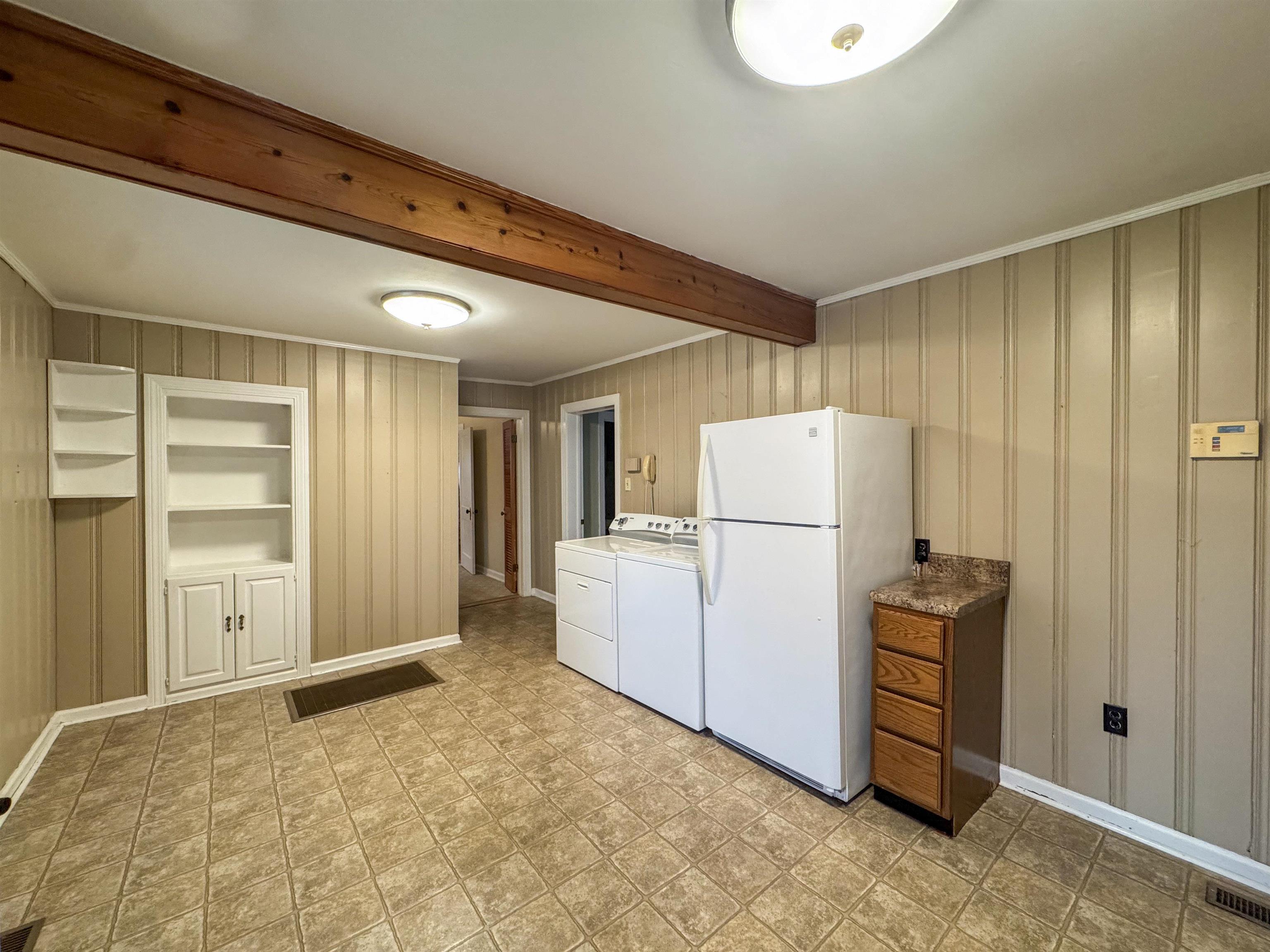 400 Park Street Covington, TN 38019 - Photo 17 of 24 a view of kitchen with refrigerator and cabinet