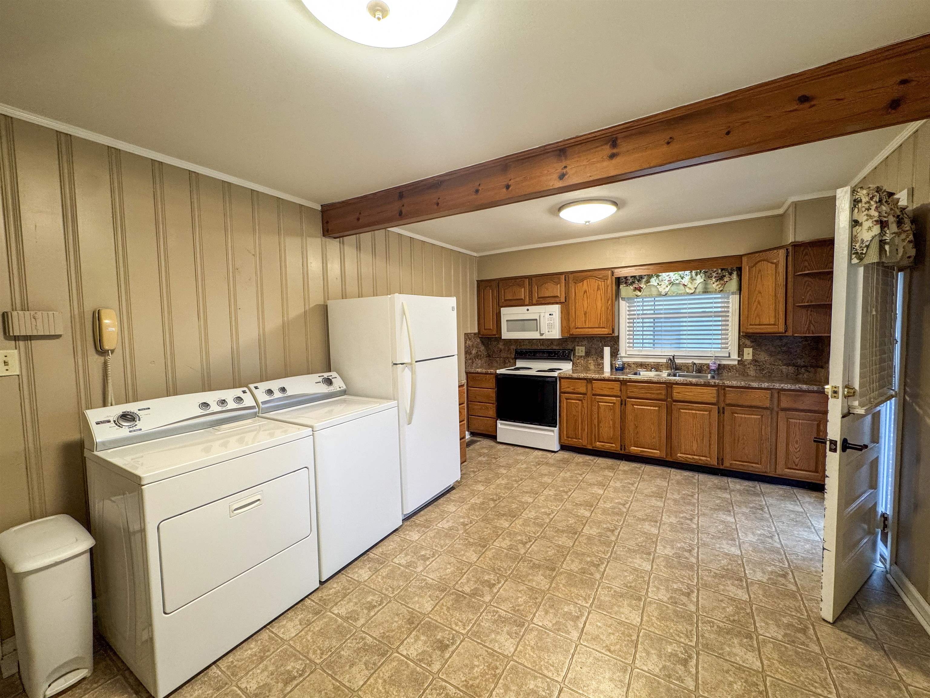 400 Park Street Covington, TN 38019 - Photo 18 of 24 a kitchen with a refrigerator and a sink