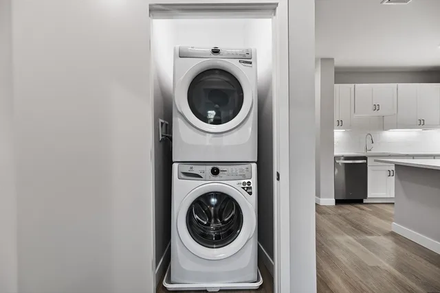 a view of a hallway with washer and dryer