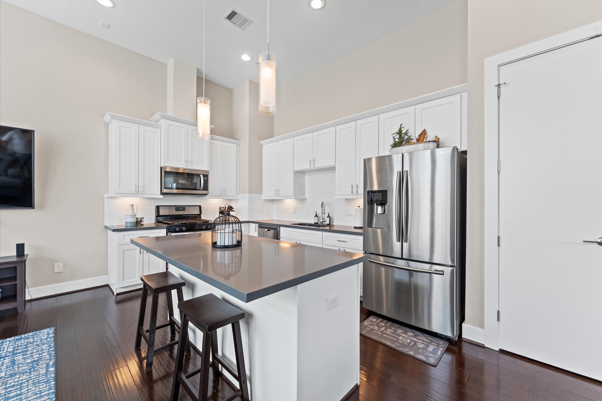 2422 Cochran Street Houston, TX 77009 - Photo 10 of 31 Gorgeous drop lights and under-cabinet lighting bring extra illumination to the kitchen.