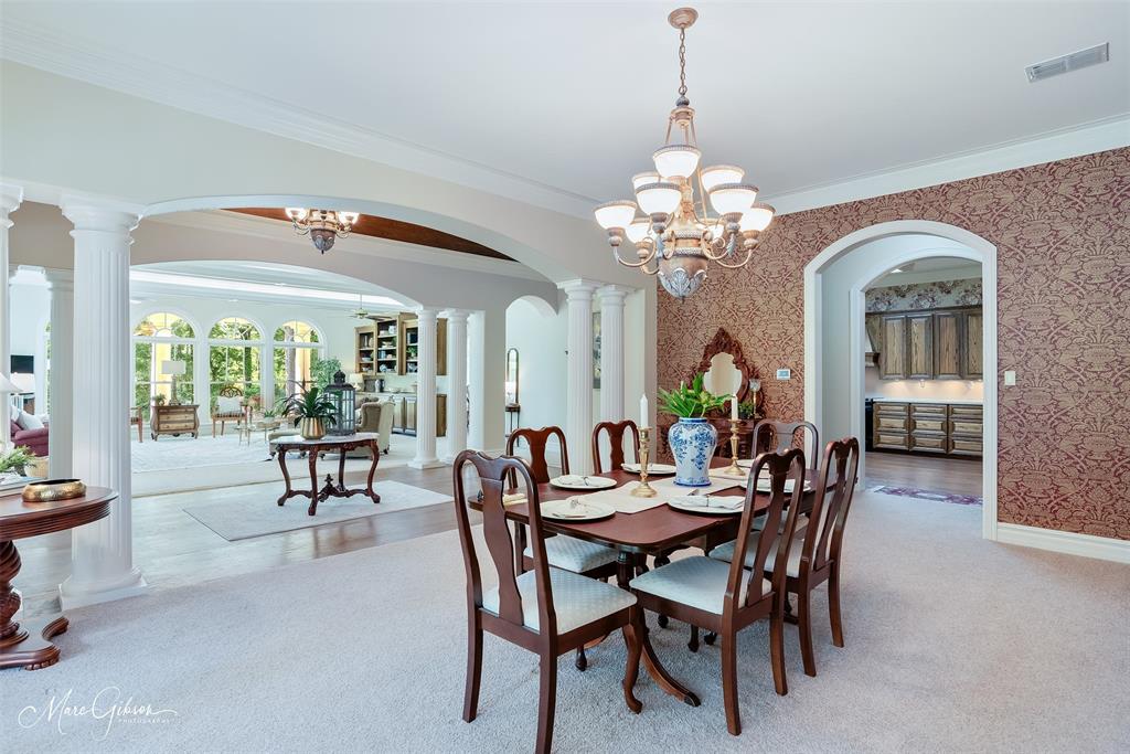 3669 Fountainbleau Road Keithville, LA 71047 - Photo 16 of 40 a view of a dining room with furniture and a chandelier