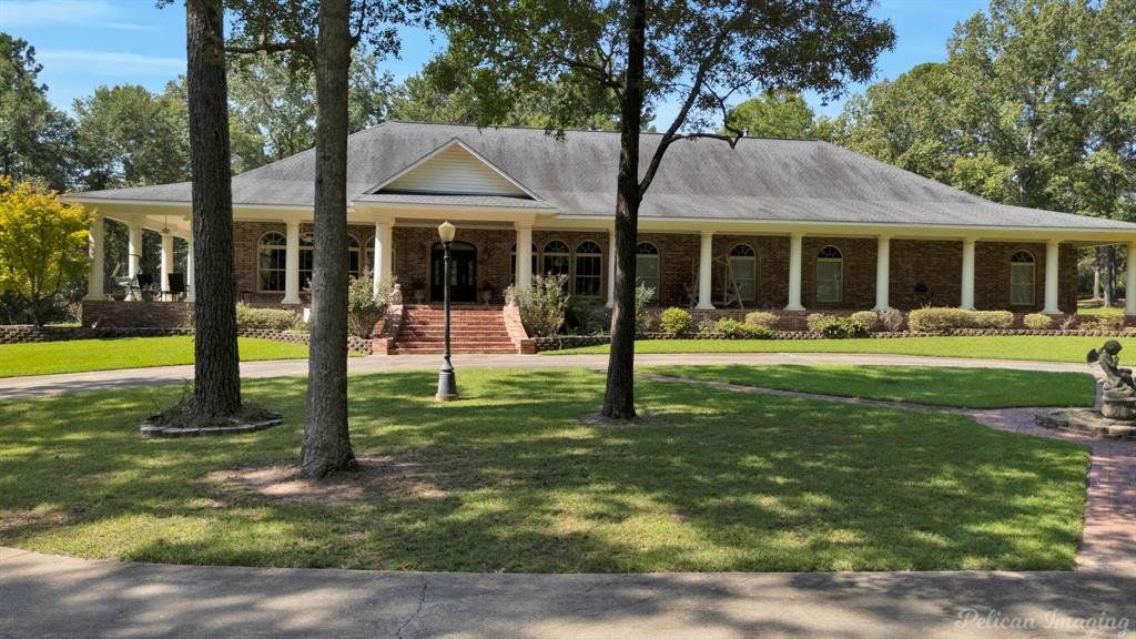3669 Fountainbleau Road Keithville, LA 71047 - Photo 2 of 40 a view of a house with a yard