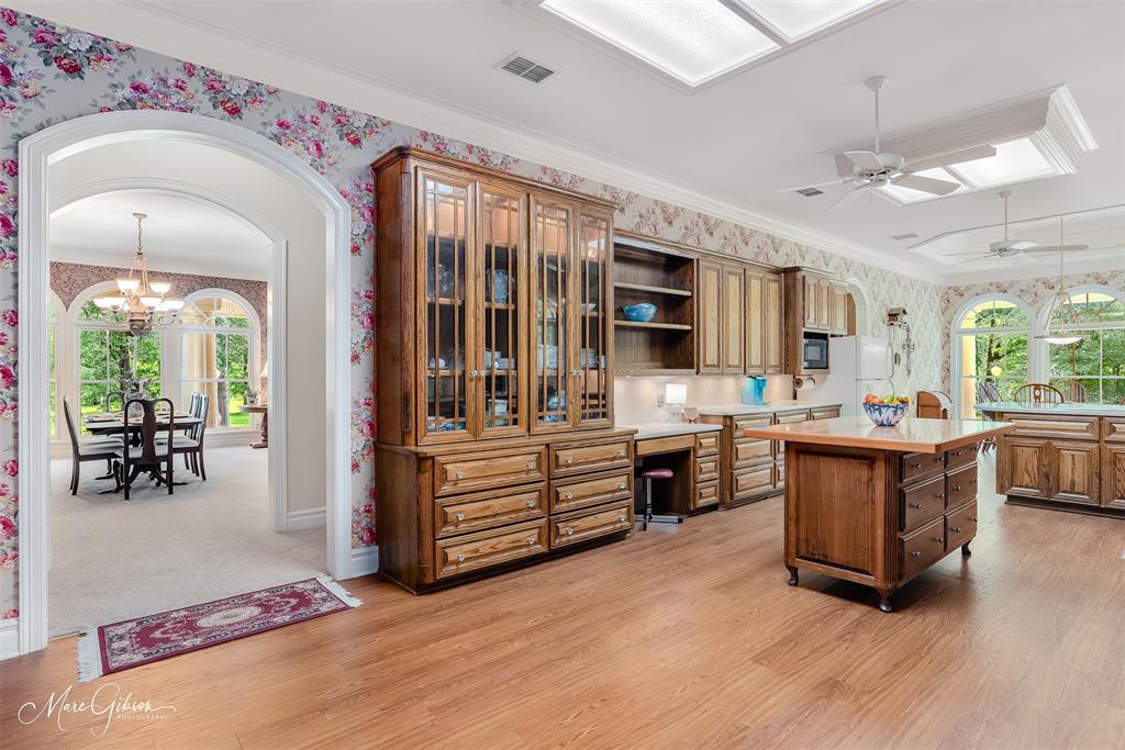 3669 Fountainbleau Road Keithville, LA 71047 - Photo 21 of 40 a large kitchen with stainless steel appliances granite countertop a lot of counter space and wooden floors